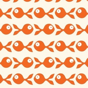 small - little fish swimming in orange on natural