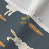 small easter rabbits and carrots on dark blue boys