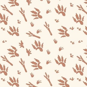 Medium Distressed Dinosaur Footprints in Mocha Brown with a Cream White Background
