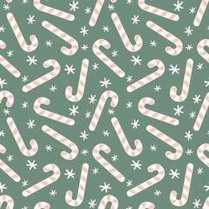 Pink candy canes on green 