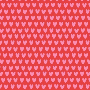 Small pink  hearts on red. Small