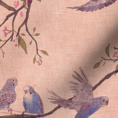A chinoiserie style design of green, blue and yellow budgie parakeets on a vintage linen texture