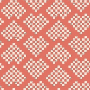 Checkered hearts in coral background