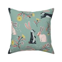 (L) rabbits / bunnies with dandelion for easter on light teal  folk art