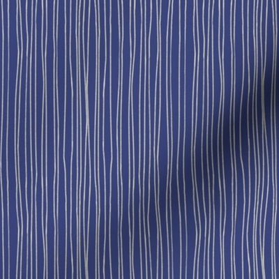 Hand-drawn or painted white stripes on navy blue