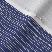 Hand-drawn or painted white stripes on navy blue