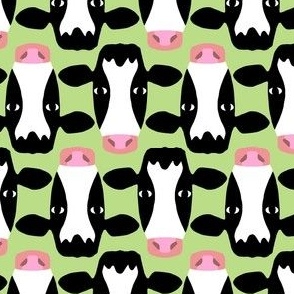 Cow heads on green