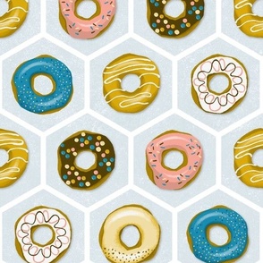 delicious colorful donuts on light blue hexagons | medium