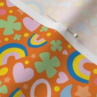 St. Patty's Symbols, Rainbow, Horseshoe, Heart, Clover, Lucky Fabric Orange Background