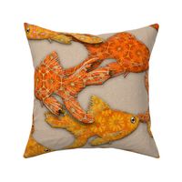 Goldfish on cream stone background