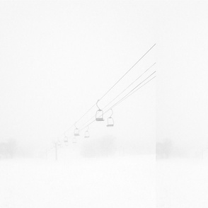 Empty Chair Lift in ski field whiteout