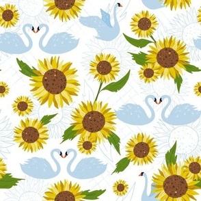 White swans and sunflowers