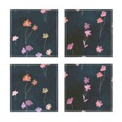 Little flower silhouettes in paper cutout style in purple and pink on a midnight blue background