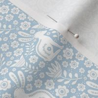 Small Scale Folk Style Easter Bunnies on Soft Blue