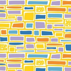 A Kaleidoscope of Bricks and Building Blocks on Dandelion Yellow Colourful Masonry Wall