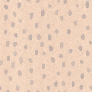 Hand drawn light grey drop drops on a sand colored vintage linen texture background