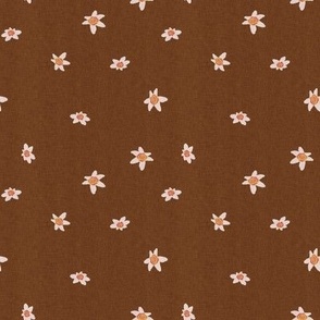 Ditsy white Edelweiss alpine flowers on a warm deep brown background with a vintage linen texture