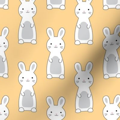 white bunnies on pastel yellow