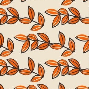 brown and orange leaf design on light tan background