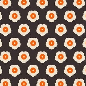 off white and orange flowers on dark brown background