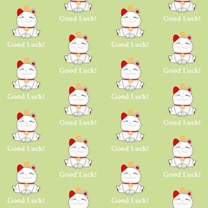 Good luck maneki neko cats on green