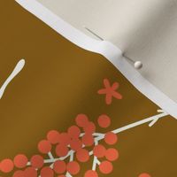Beige leaves and branches with coral red berries and flowers on golden background