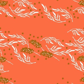 Beige branches and golden berries and flowers on red coral background