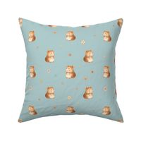 Cute little hamsters with daisy flowers on blue