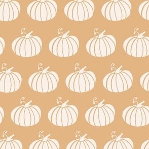 horizontal line of pumpkins on pastel background