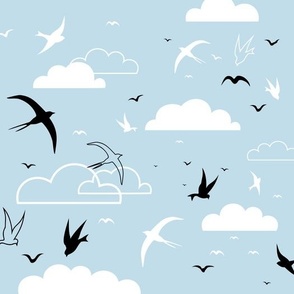 Mid Century Birds Swallows Flying in a Partly Cloudy Pale Blue Sky