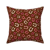 Medium Scale Pink Cowgirl Horseshoes on Brown