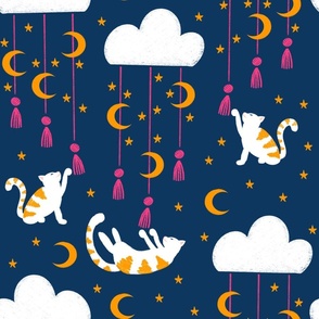 Cats playing with tassels hanging from clouds in space
