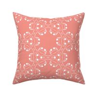 White geometric floral on coral