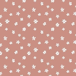 Simple ditsy flowers on pink background