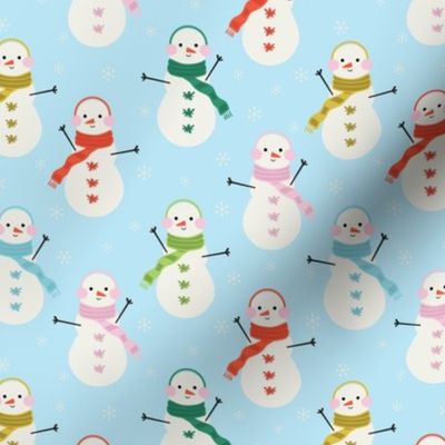 Cheerful Christmas snowmen on light blue background