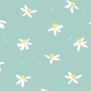 Minimalist paper cut daffodils and seeds for spring - blossom garden abstract flower design orange white on light teal blue
