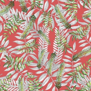 Green and gray tropical leaves on a coral background