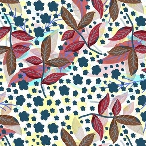 Composition of leaves and flowers on a multi-colored background