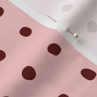 Maroon spots on pink
