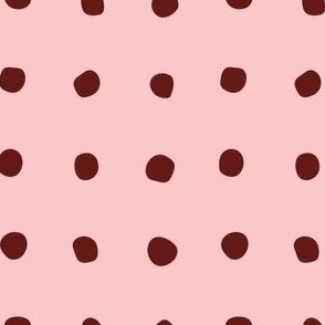 Maroon spots on pink