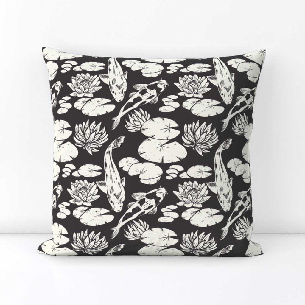 Koi fish and water lily pads in pond black and white