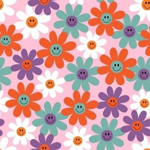 fun retro smiling flowers on a pink background