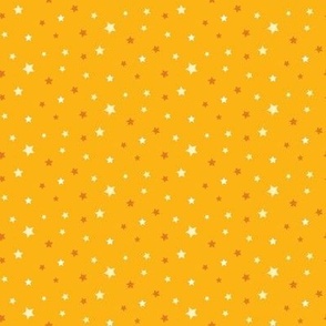 Retro eggshell, white and burnt orange ditsy stars on mustard yellow quilt fabric