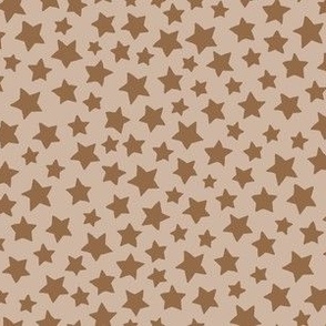 Tiny camel colored stars on a light tan ground / allover pattern