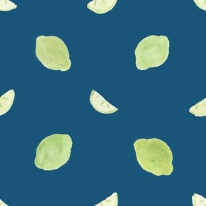 limes and slices blue background