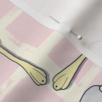 Butter yellow and piglet pink fork and spoon on lined background