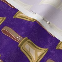Medium Scale Gold Handbells on Regal Purple