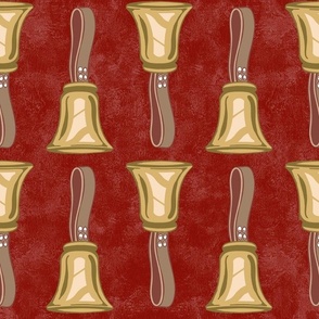 Large Scale Gold Handbells on Rusty Red