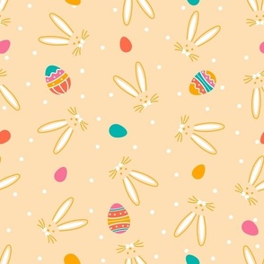 Easter bunny and eggs on a beige background with polka dots.