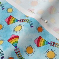 Small Scale Rainbow Kites and Sunshine on Blue Skies